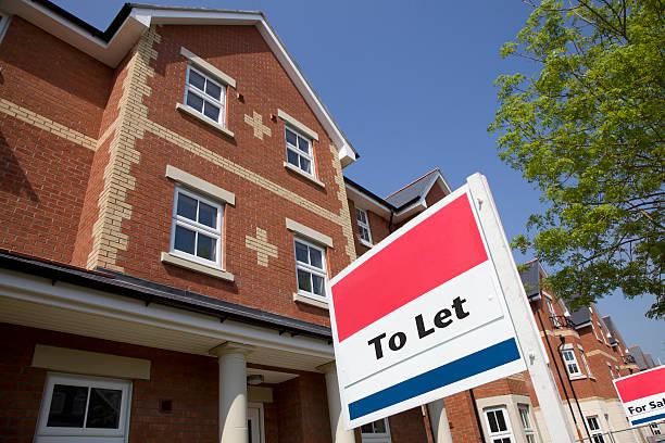 Image of a block of apartments with a 'to let' sign outside