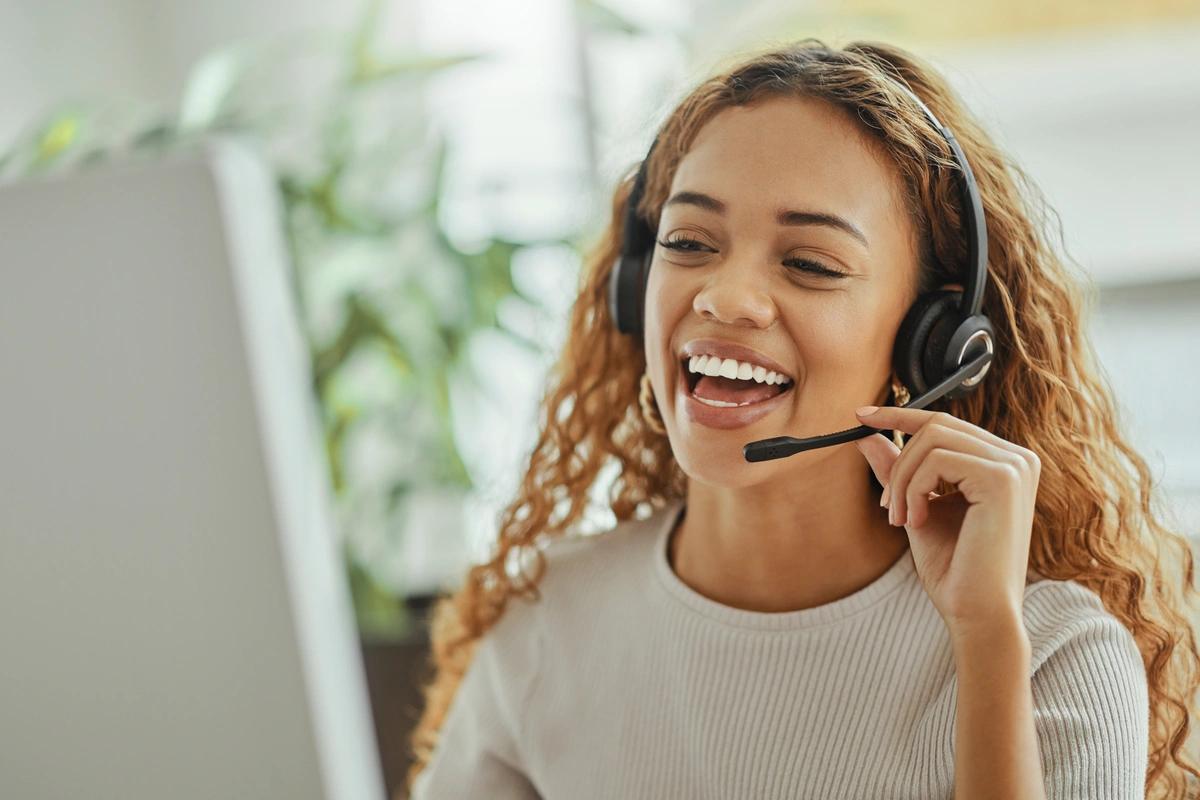 A debt adviser chats to a customer on the phone