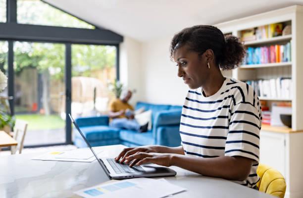 Someone working on a laptop. Giffgaff trials superfast broadband for just £10 a month. Get £100 for testing giffaff's broadband