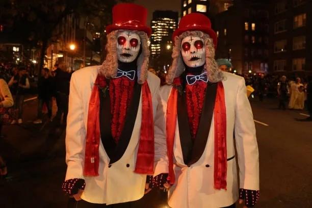 Image of two men in zombie suits for Halloween. Trick or treat? What to do if a bailiff knocks this Halloween