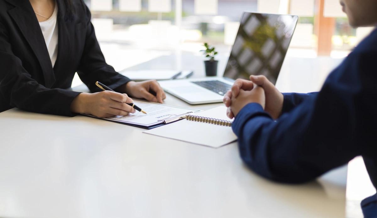 Benefits claimant speaks to an adviser at the JobCentre