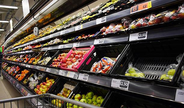 Image of a supermarket fruit shelf with the labels in focus. Clamp down on hidden booking fees, fake reviews and labelling