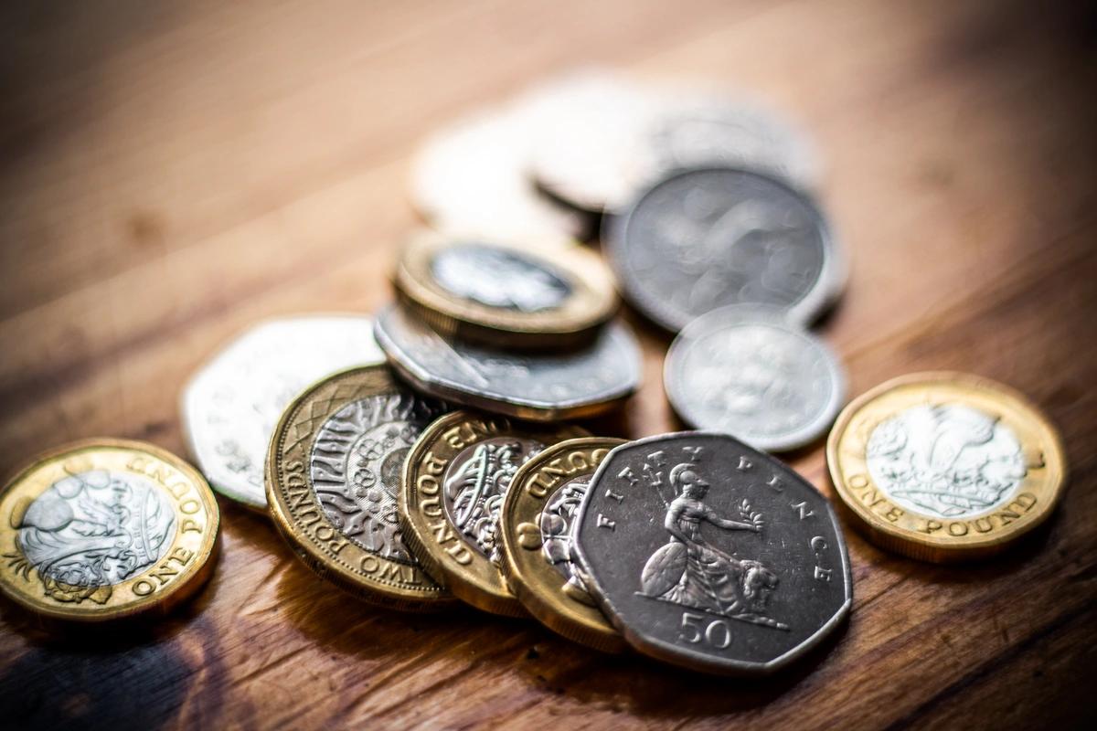 Coins on wooden table