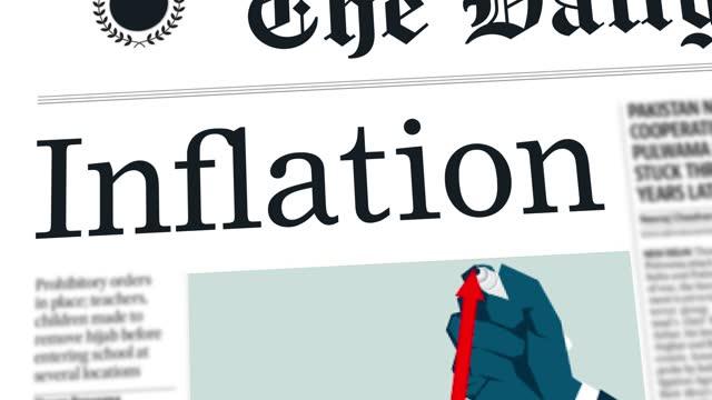 image of a newspaper with an graph showing an up trend for inflation