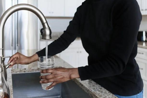 Image of someone filling a glass of water from the tap. The average water debt we're seeing is now £1,163. Water debt is rising, but £190 a year in support is going unclaimed