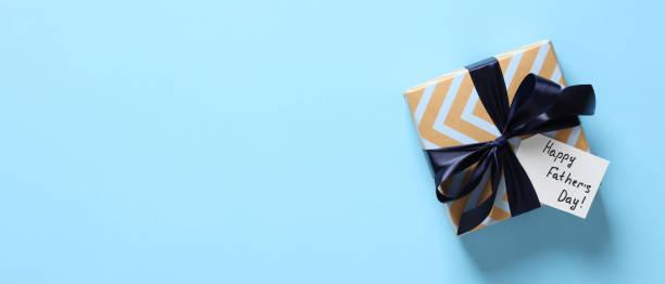Image of a gift wrapped with a tag that says 'Happy Father's Day'