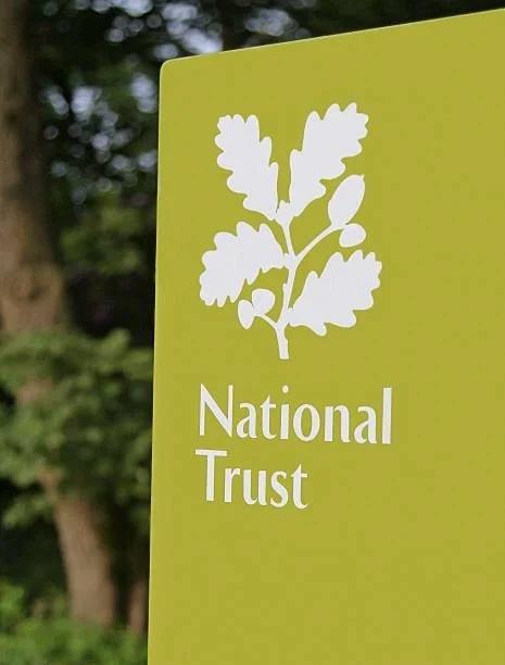 Image of a National Trust sign. How to get a free National Trust family pass this summer. All the places to find free National Trust day out passes this summer 2026