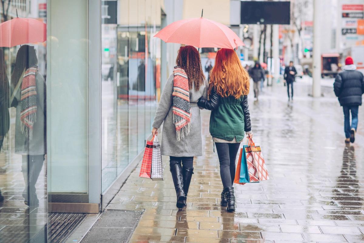 Shoppers on a rainy high street