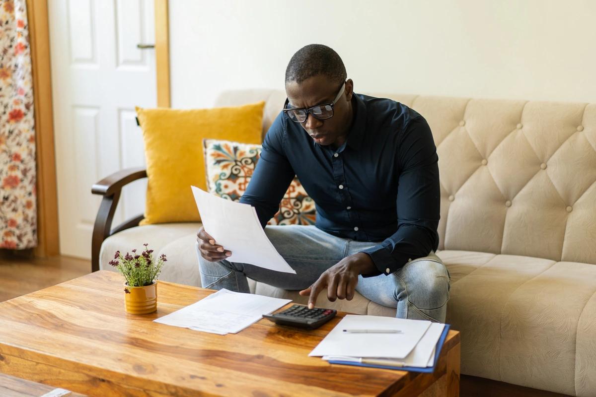 A homeowner working out what his mortgage costs will be