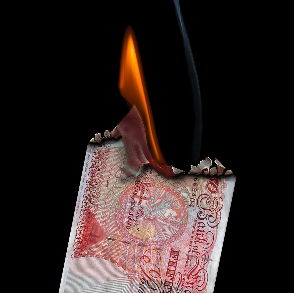A £50 note on fire
