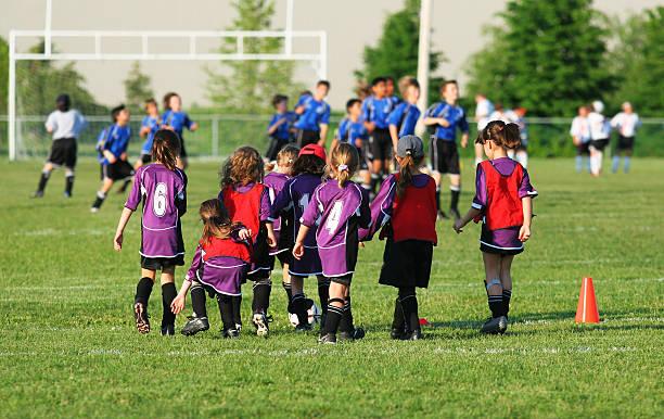 Image of young children playing football