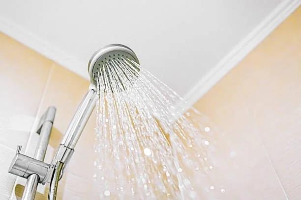 Image of a shower running. 6 things people do in hot weather that don't work (and cost you money)From cold showers to turning the fridge down, some of the most common ways of coping with heat either don't help or cost you money.