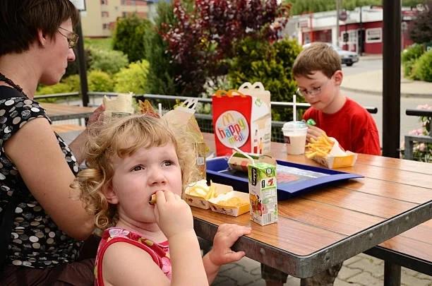 Image of kids eating a McDonalds Happy Meal. McDonald's slashes Happy Meal prices for the summer holidays - here's how to get one for £2.99.. Parents can pick up Happy Meals for less than £3 throughout the summer holidays, but you'll need to use the