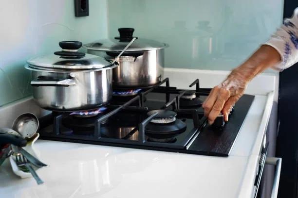 Image of pots on a gas stove. Millions of British Gas customers could slash bills with new tariff as energy prices expected to rise again