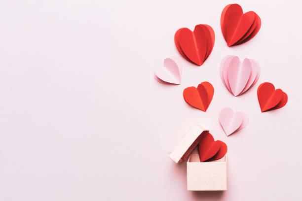 image of paper hearts escaping from a pink box