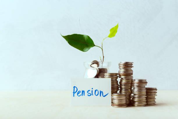 Image of money stacked up with a post-it note in front saying pension. Big change to pensions could leave you £1,000 better off