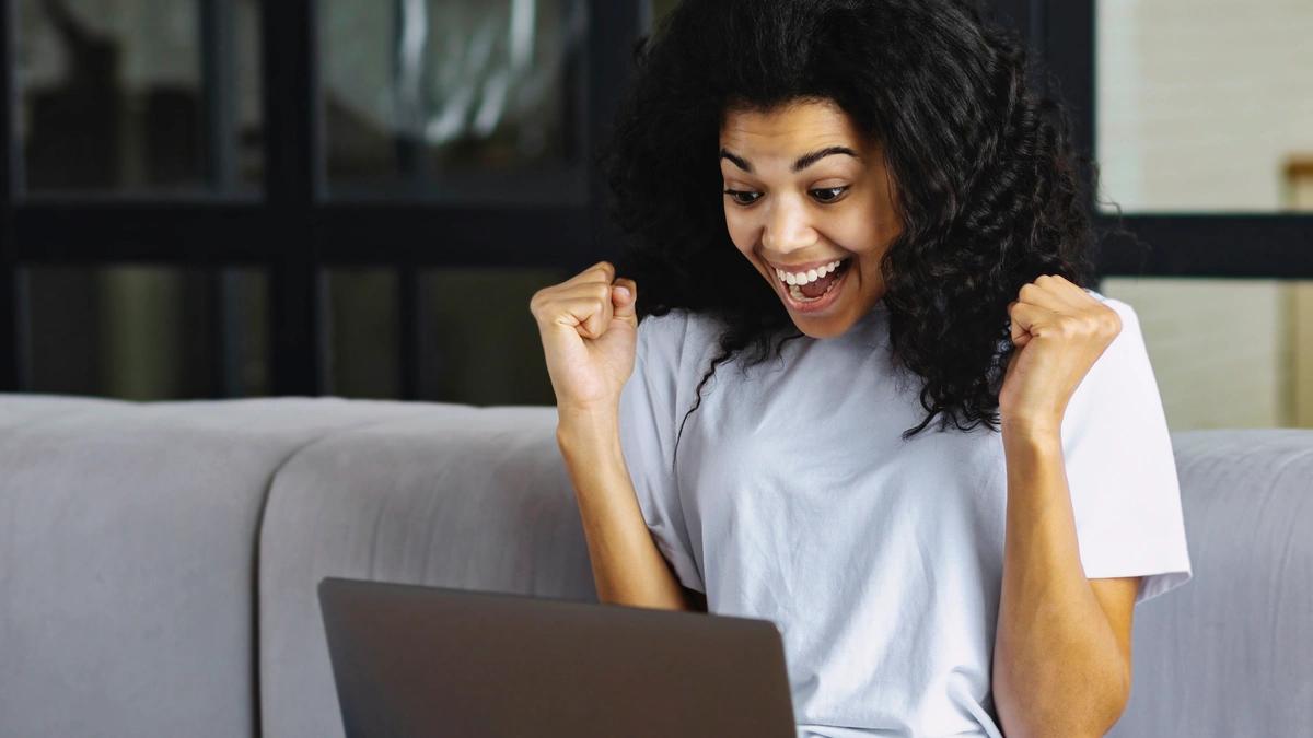 A woman receives notification that she's won an online competition
