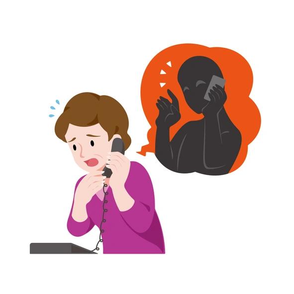 A woman taking a call with a worried expression