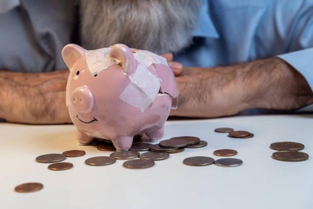 Image of a broken piggy bank. Seven sure signs that your debt is becoming unmanageable. And what to do about it