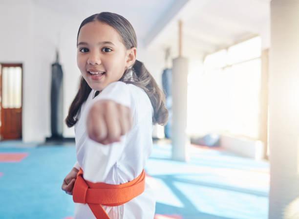 Image of a little girl trying out judo