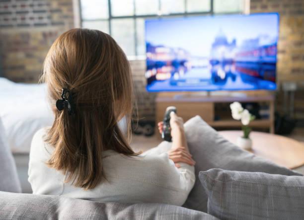 Image of someone watching TV. Disney+ prices to increase from the weekend. Disney+ password sharing clampdown