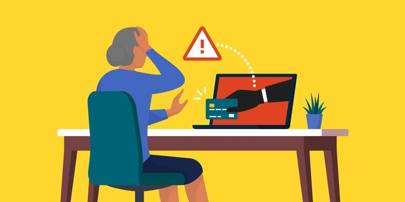 illustrated woman stressed at a PC after being scammed