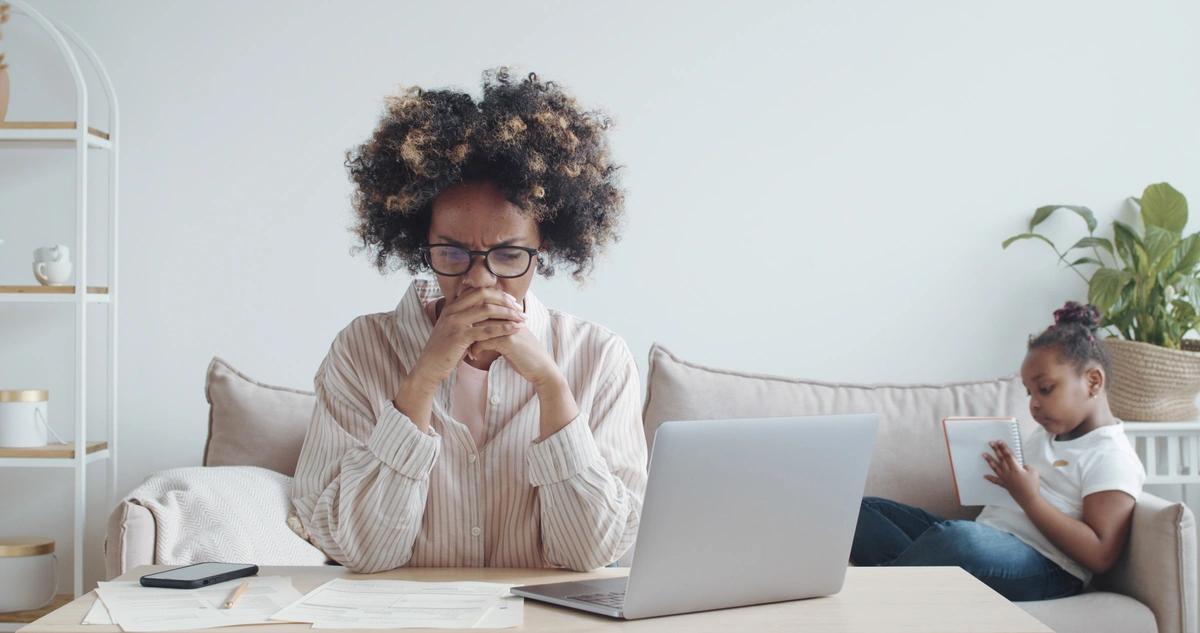 A worried woman going through her finances