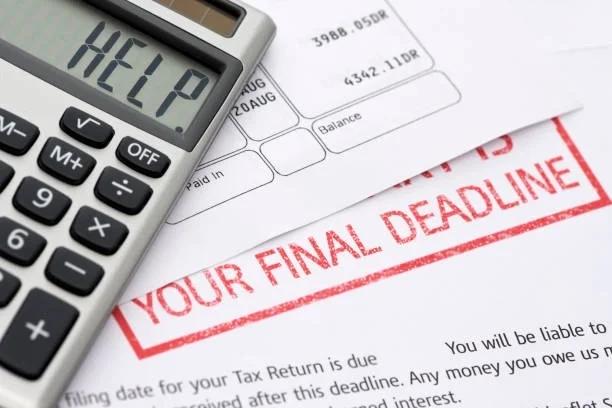 Image of final demand letters with a calculator on top saying HELP. More than 1.5 million households faced council tax court action last year