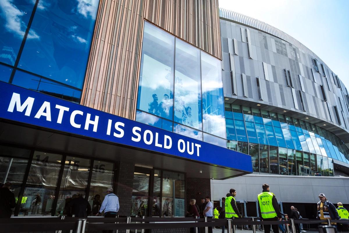 Sign outside premier league football stadium saying "match is sold out"