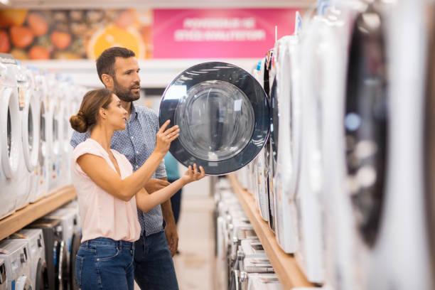 Image of a couple shopping for a washing machine