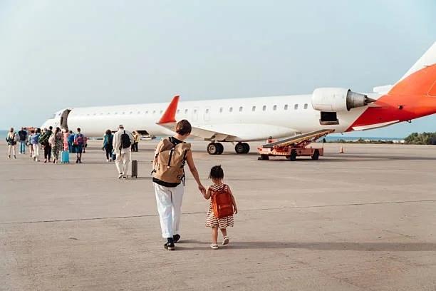 Image of a family about to board a plane. 10 ways to keep your home safe if you're heading off on holiday (without spending a penny)