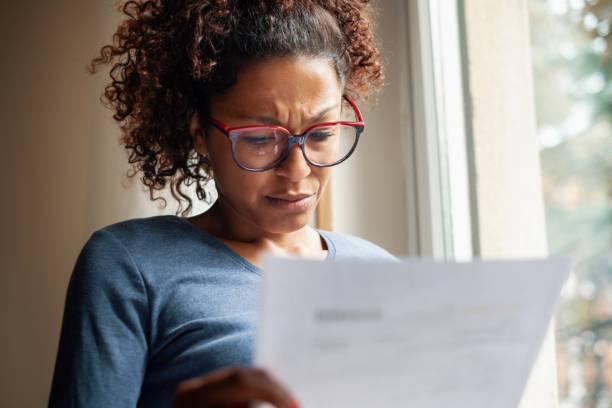 Image of a woman reading a letter