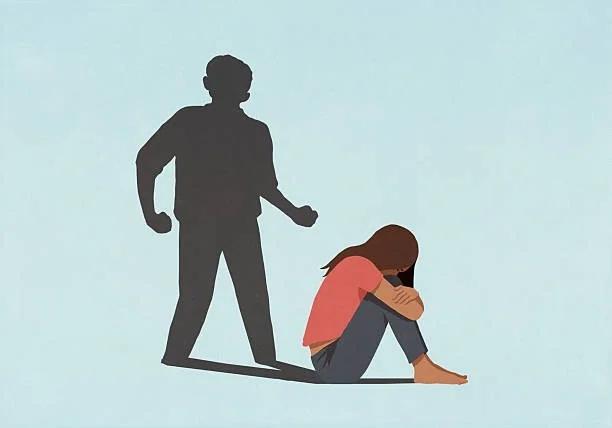 Image of a shadow standing over someone cowering. New housing reforms could help domestic abuse survivors stay in their homes – and avoid debt. Economic abuse. Financial abuse and debt. Social housing bill
