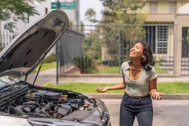 Someone stood looking disressed next to a brokend down car. Emergency savings searches soar 950% as households look for a financial safety net. More people are searching for ways to build a financial buffer, but rising household costs mean saving for