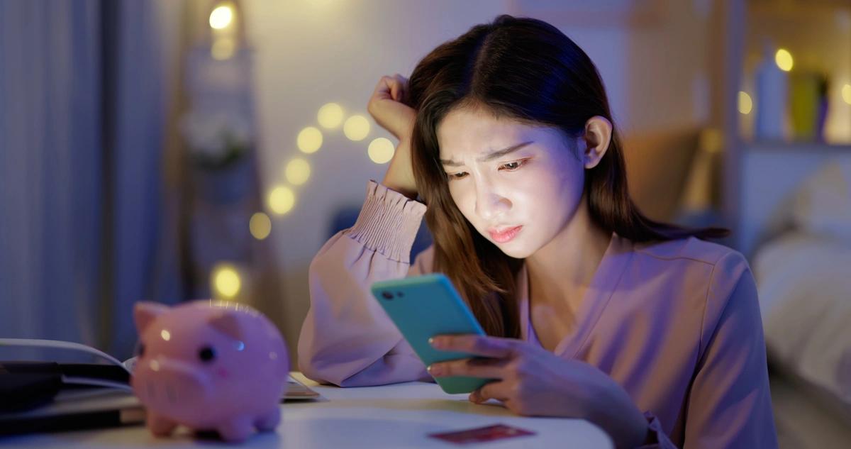 A worried woman going through her finances