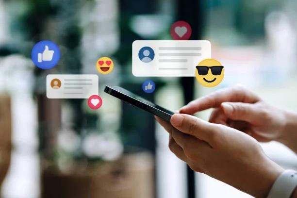 Image of someone on a mobile phone surrounded by messages and emojis. Forget avocado toast – why young people are turning to TikTok money trends to get their finances back on track