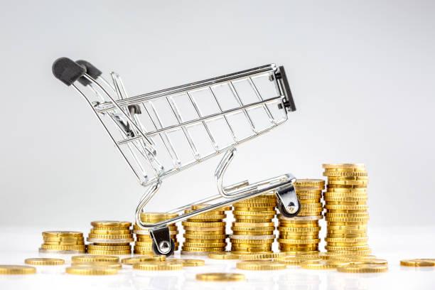 Image of a shopping trolly going up rising pound coins depicting rising food prices