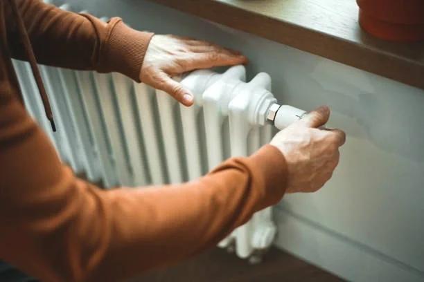 Image of someone adjusting a radiator. Millions of households pay hundreds upfront to heat their homes - now the watchdog says they deserve better protection. Heating oil customers could benefit from better consumer protections under new CMA proposal