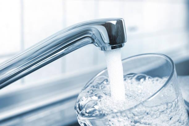 Image of someone filling a glass from a kitchen tap. What if you can't pay your water bill