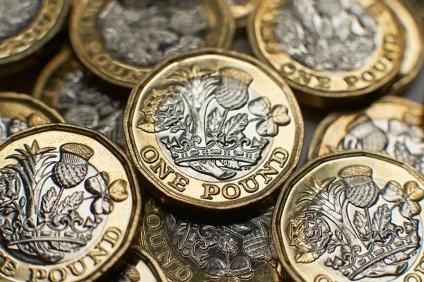Image of a pile of coins. 4 in 10 people who cannot find £300 in an emergency earn more than the average wage. Money worries are no longer just hitting the lowest paid. Find out what help is available