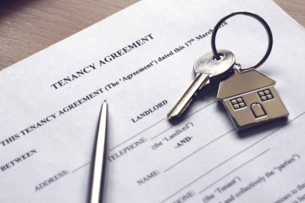 Image of a tenancy agreement with a pen and a set of keys on top