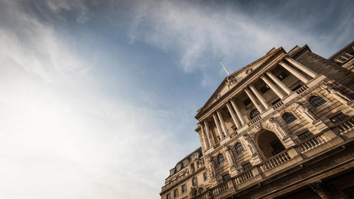 A shot looking up at the Bank of England under a cloudy sky