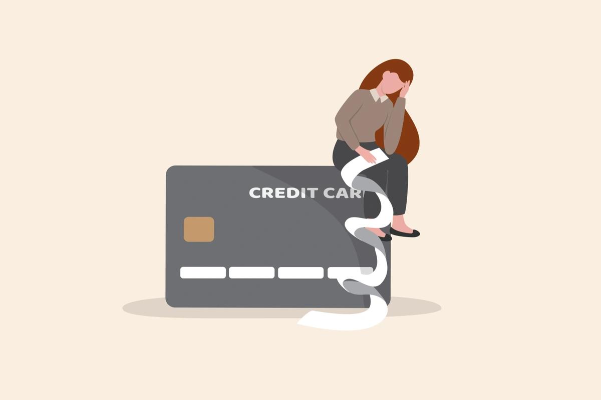 Illustration of a woman sitting on a big credit card going through her debts